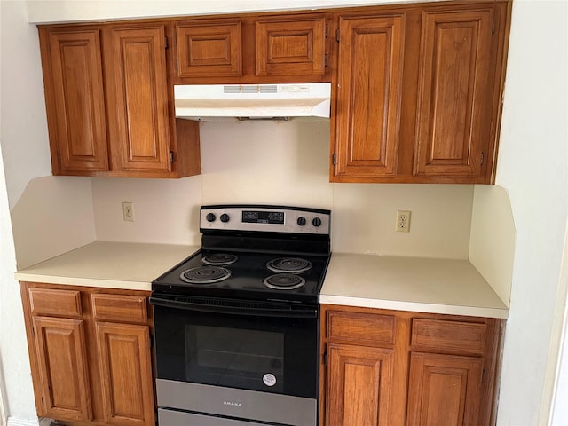 kitchen with stainless steel range with electric cooktop