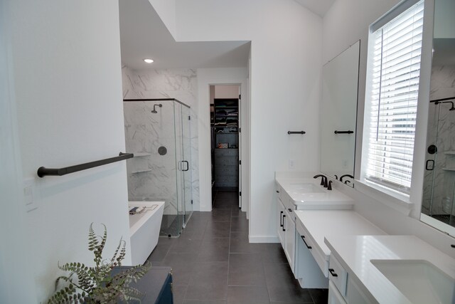 bathroom with shower with separate bathtub, tile patterned floors, and vanity