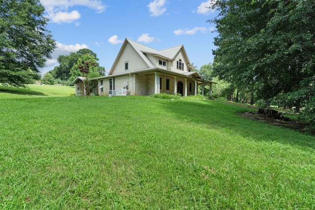 235 Fm 3313, Crockett, TX 75835 - view of front of property with a front yard, brick siding, and a metal roof
