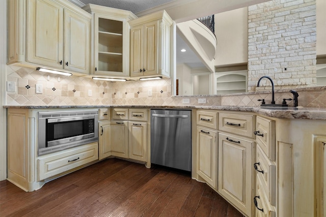 235 Fm 3313, Crockett, TX 75835 - kitchen featuring cream cabinetry, stainless steel appliances, dark wood-style flooring, and backsplash