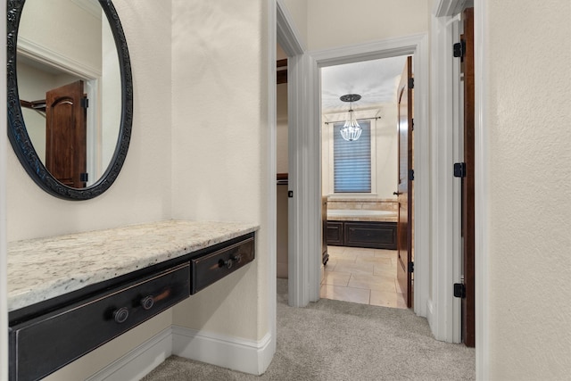 235 Fm 3313, Crockett, TX 75835 - corridor with light colored carpet and a chandelier