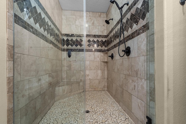 235 Fm 3313, Crockett, TX 75835 - bathroom featuring a shower stall and a textured ceiling