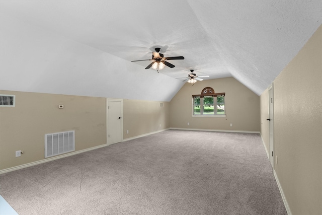 235 Fm 3313, Crockett, TX 75835 - additional living space with a ceiling fan, lofted ceiling, carpet floors, and a textured ceiling
