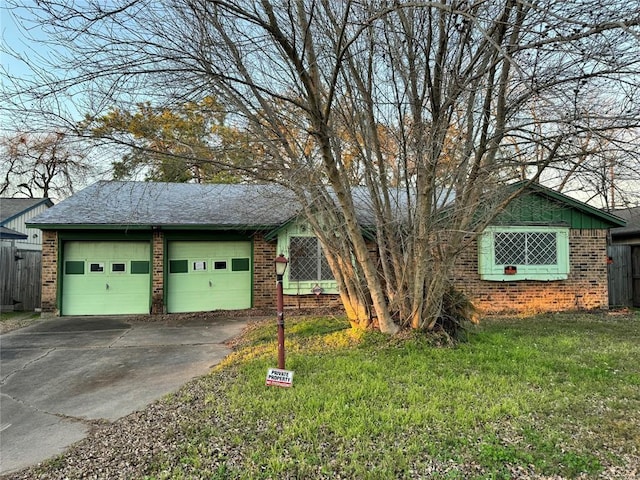 exterior space featuring a lawn and a garage