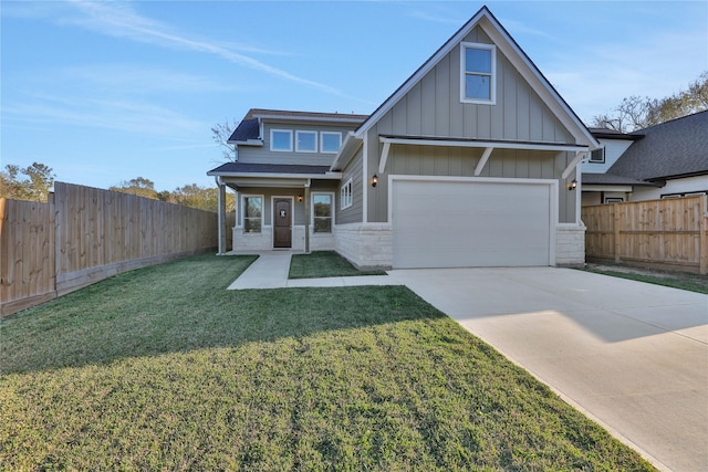 view of front of home featuring a porch, a front yard, and a garage