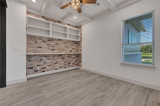 unfurnished room with ceiling fan, beamed ceiling, wood-type flooring, and coffered ceiling