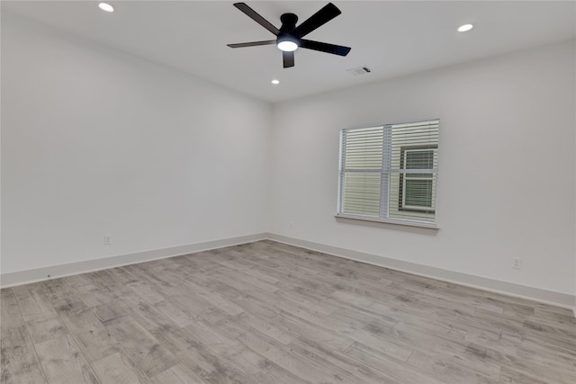 unfurnished room featuring ceiling fan and light hardwood / wood-style flooring