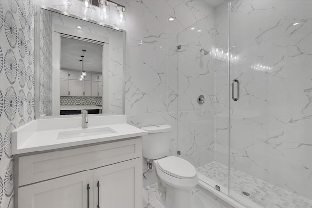 bathroom featuring vanity, toilet, an enclosed shower, and tile walls