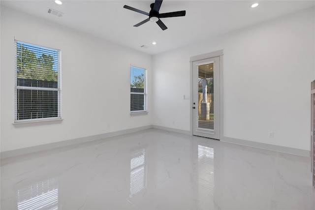 empty room with plenty of natural light and ceiling fan