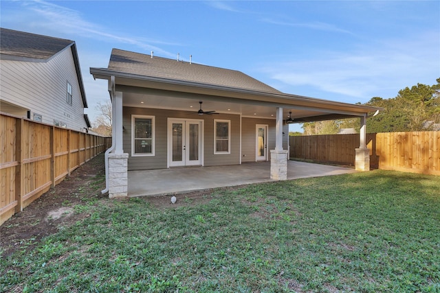 back of house featuring a lawn, ceiling fan, a patio, and french doors