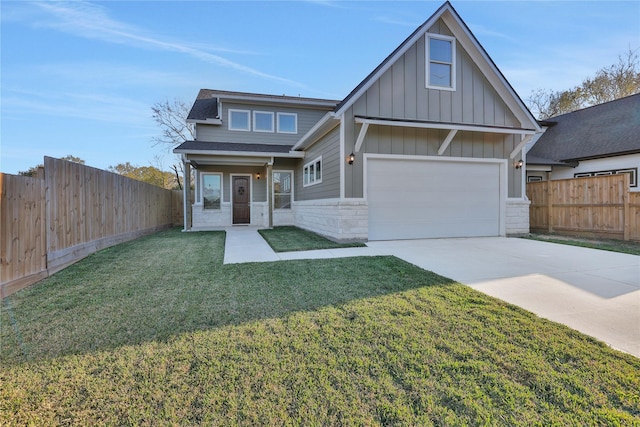 craftsman-style home with a front lawn and a garage