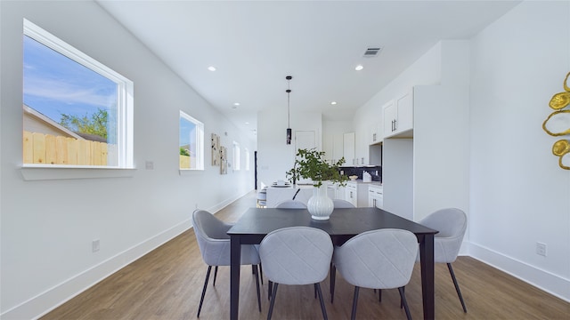 dining area featuring wood-type flooring