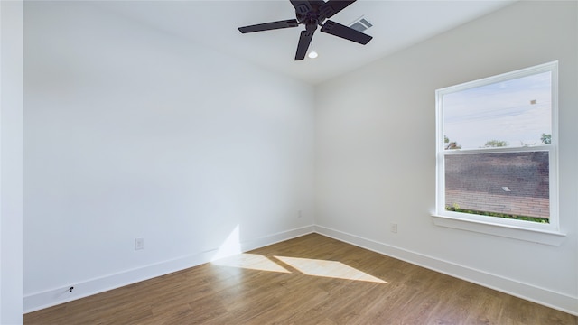 unfurnished room with hardwood / wood-style floors and ceiling fan