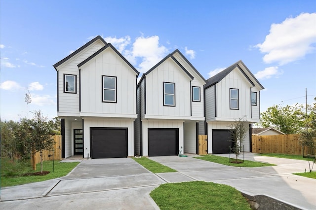 view of front facade featuring a garage and a front lawn