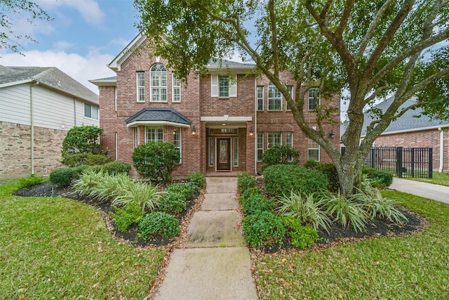 front facade with a front lawn