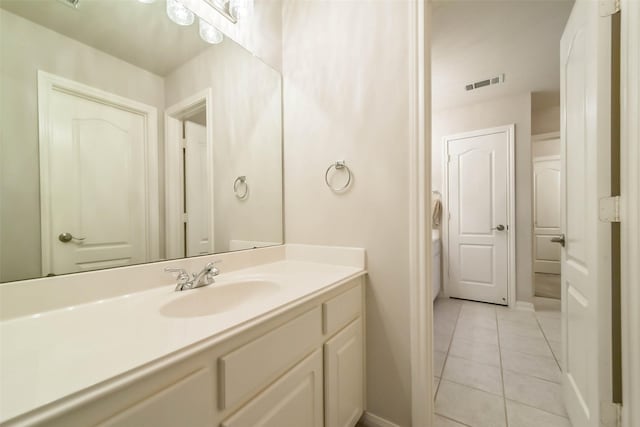 bathroom featuring tile patterned floors and vanity