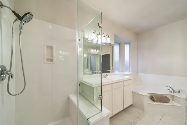 bathroom featuring tile patterned floors, vanity, and independent shower and bath