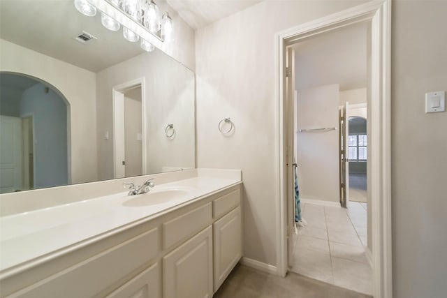 bathroom with tile patterned flooring and vanity