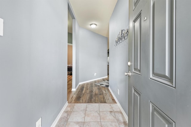 hallway with light tile patterned flooring