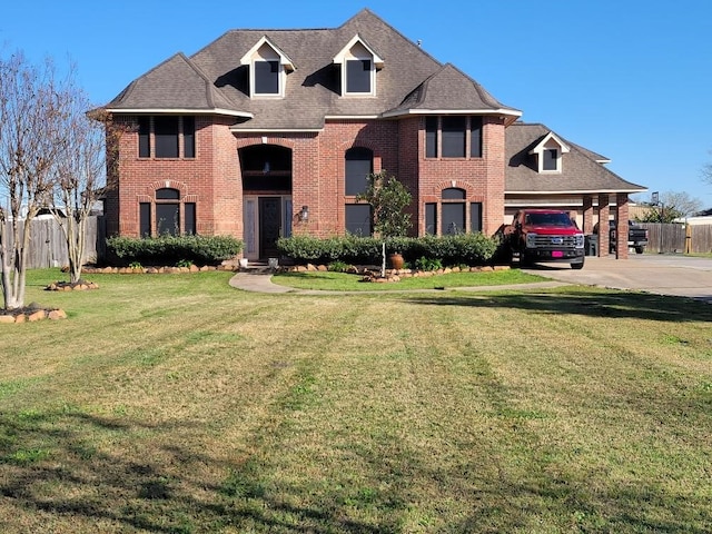 view of front facade featuring a carport and a front yard