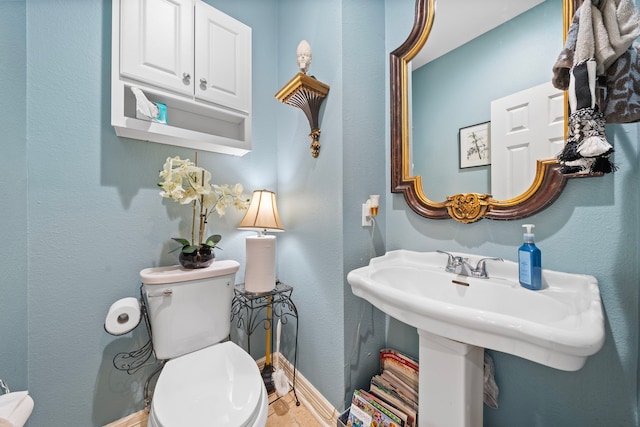 bathroom with toilet and sink