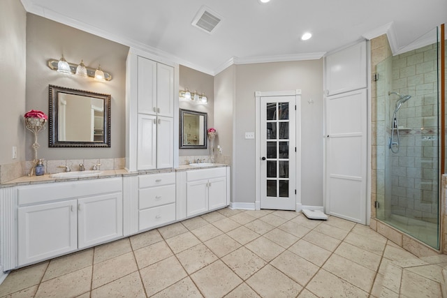 bathroom with crown molding, vanity, and a shower with shower door