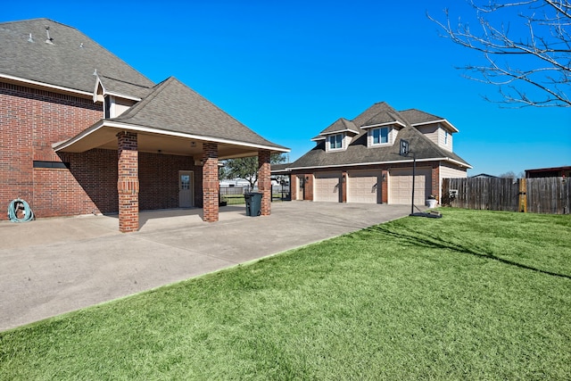 view of property exterior with a yard and a garage