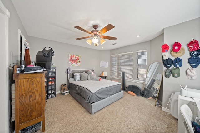 carpeted bedroom featuring ceiling fan