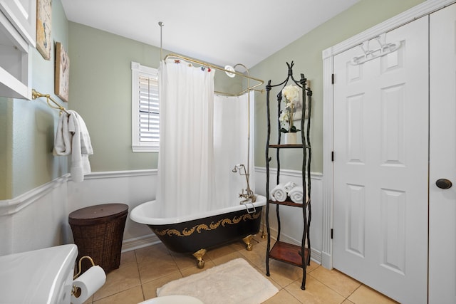 bathroom featuring shower / tub combo with curtain and tile patterned floors