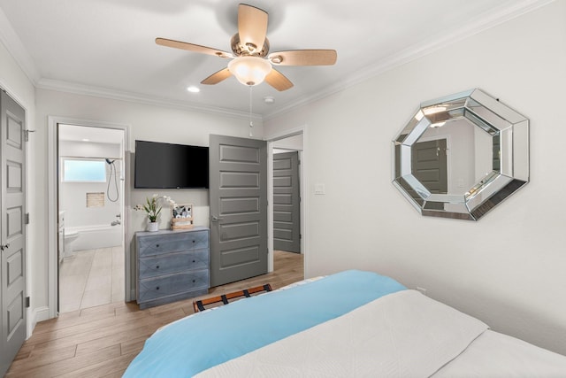 bedroom with ceiling fan, crown molding, and ensuite bathroom