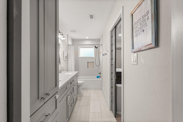 full bathroom featuring vanity, toilet, and shower / bath combo with shower curtain