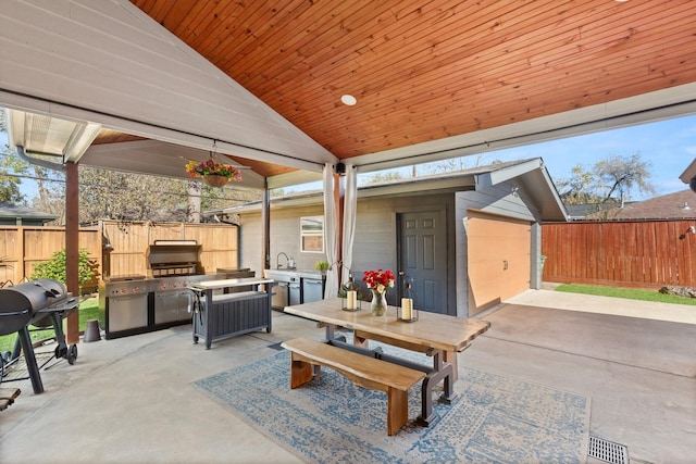 view of patio with a grill and sink