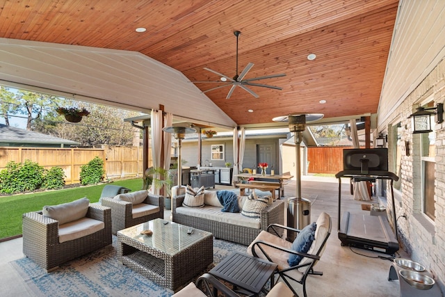 view of patio with outdoor lounge area and ceiling fan