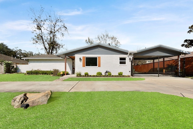 ranch-style house with a front yard and a carport