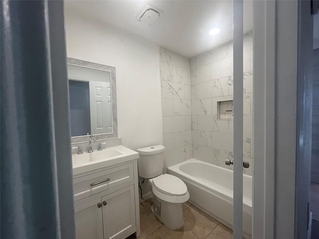 full bathroom featuring tile patterned floors, vanity, toilet, and tiled shower / bath combo