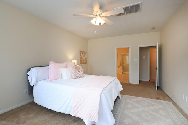 bedroom featuring light carpet and ceiling fan