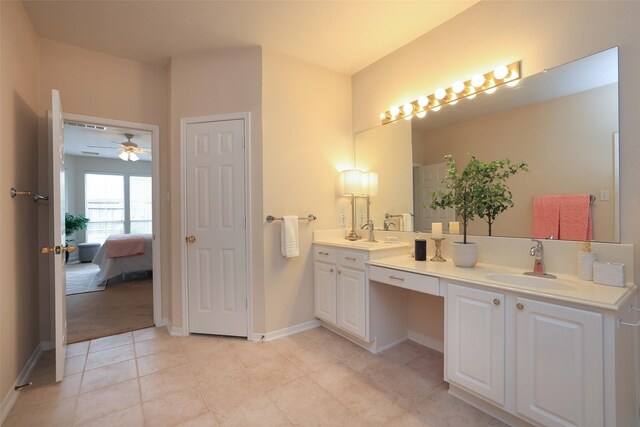 bathroom with ceiling fan, vanity, and tile patterned flooring