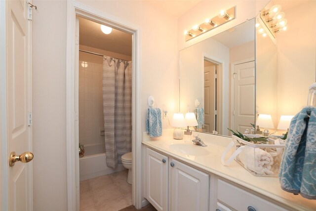 full bathroom with toilet, vanity, tile patterned flooring, and shower / bathtub combination with curtain