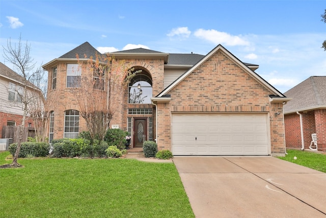 view of front of property with a garage and a front yard