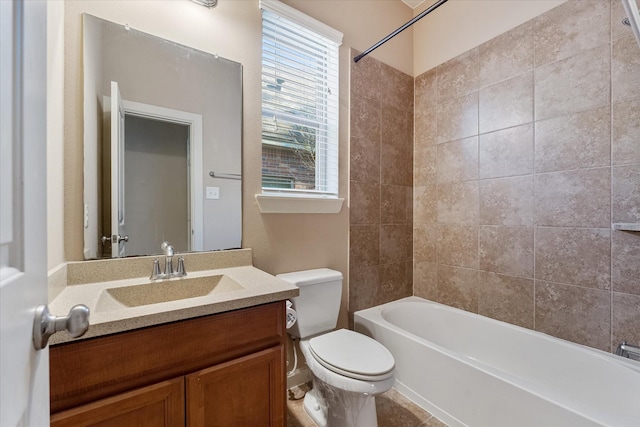 full bathroom with vanity, toilet, and tiled shower / bath