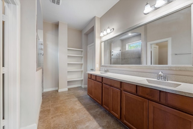 bathroom featuring a shower and vanity