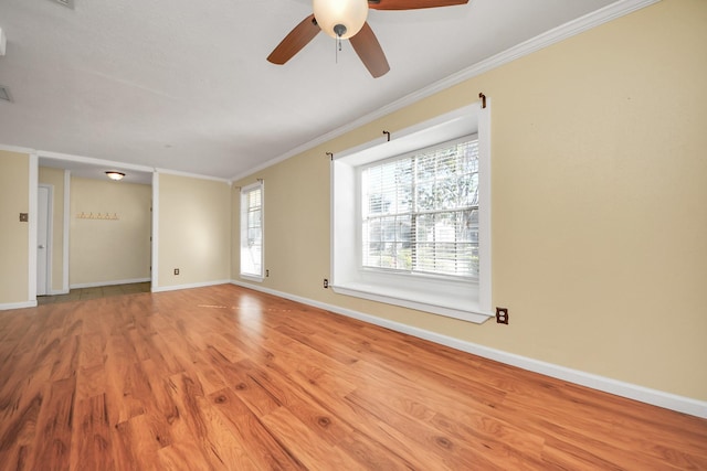 spare room featuring ceiling fan, light hardwood / wood-style floors, and ornamental molding