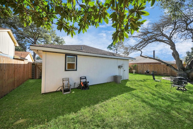 rear view of house with a yard