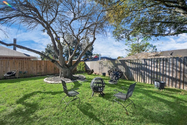 view of yard with an outdoor fire pit