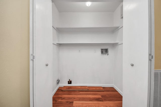 laundry room with hardwood / wood-style flooring and hookup for a washing machine