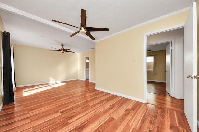 unfurnished room with crown molding and light wood-type flooring