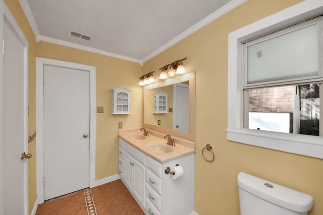 bathroom featuring tile patterned floors, vanity, toilet, and ornamental molding