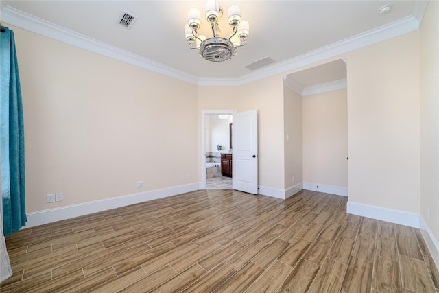 unfurnished room with ornamental molding and a chandelier