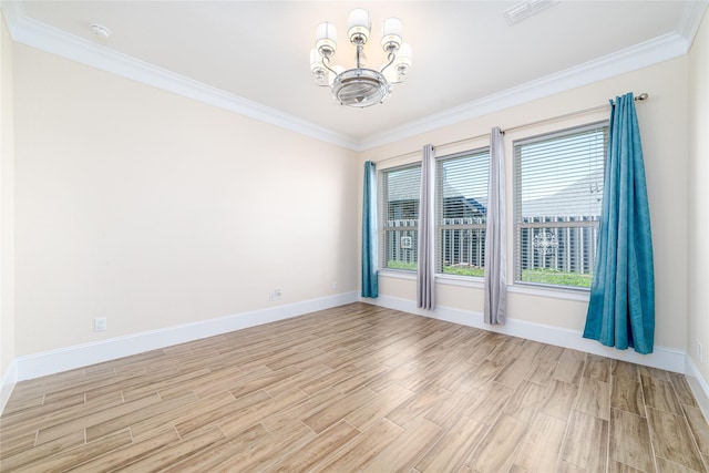 spare room featuring crown molding, light hardwood / wood-style flooring, and an inviting chandelier