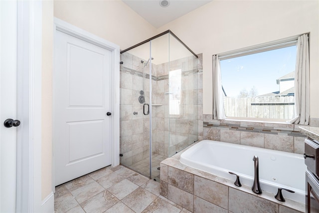 bathroom featuring separate shower and tub